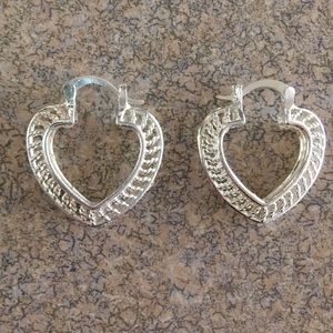 Chrome heart-shaped earrings.